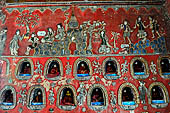 Myanmar, Burma, Nyaungshwe. Small Buddhas set into the temple wall, Shwe Yaunghwe Kyaung monastery, near Inle Lake. 